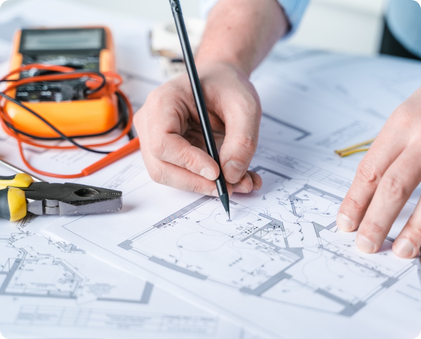 Illustrative electrical planning with drawings and a test meter