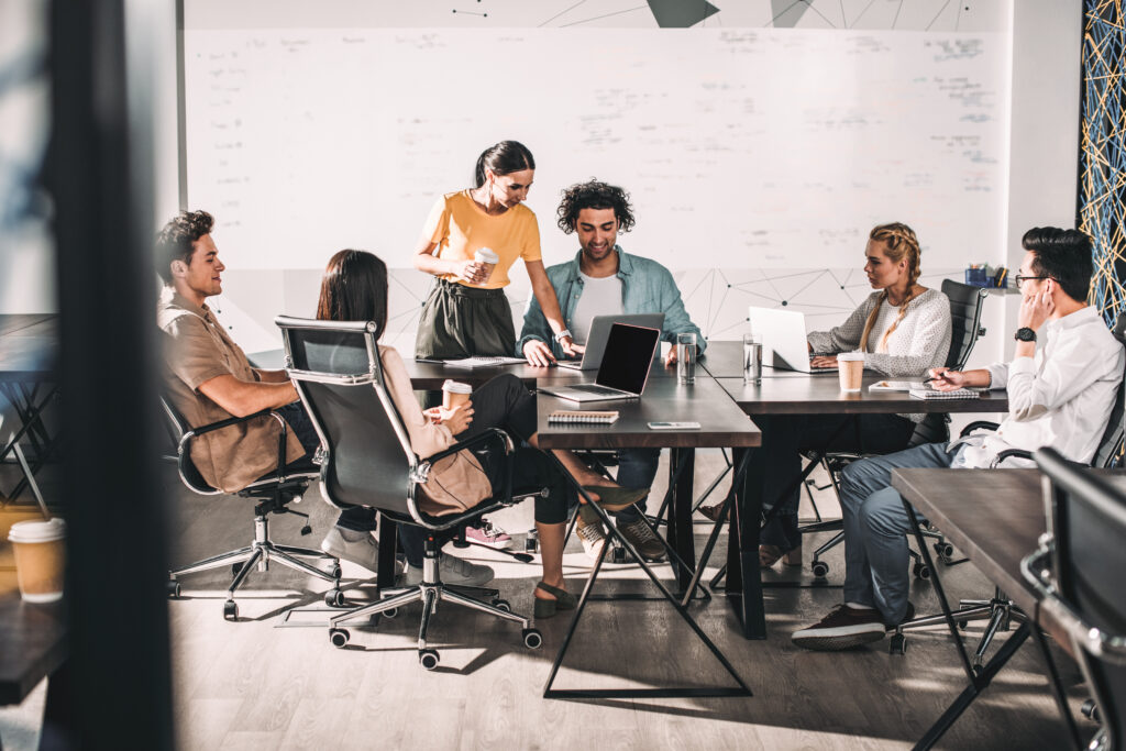 Illustrative workplace meeting; not an ARM Electrix team photograph