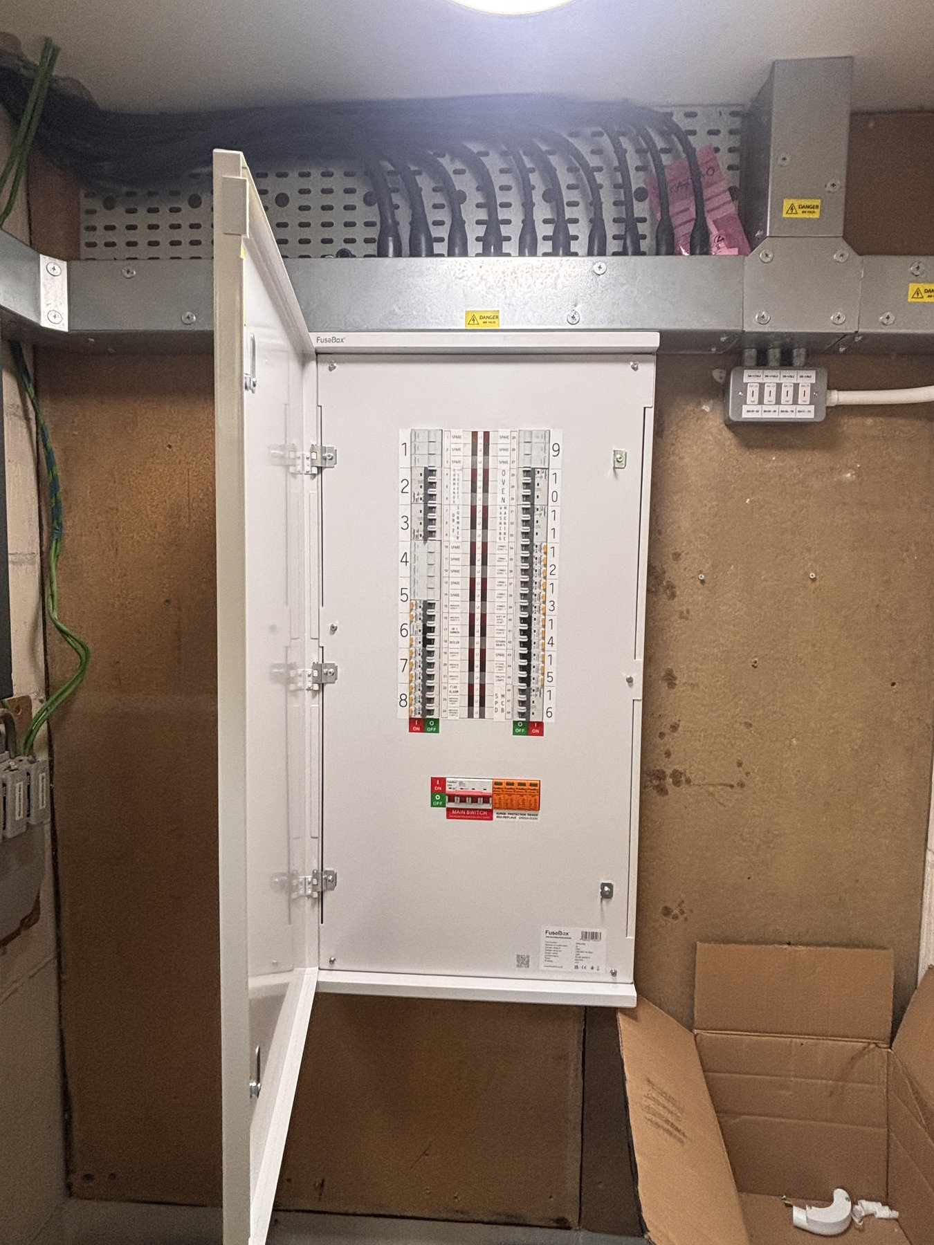 Finished distribution board with cable containment at a St Neots project