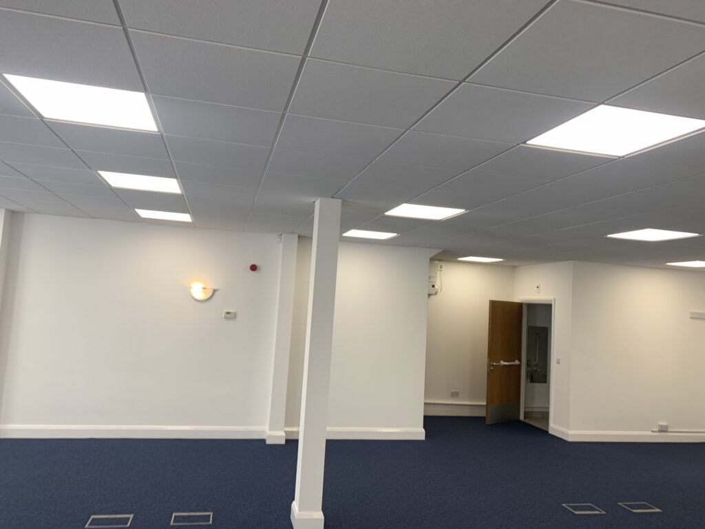 LED ceiling panels in an open-plan commercial interior