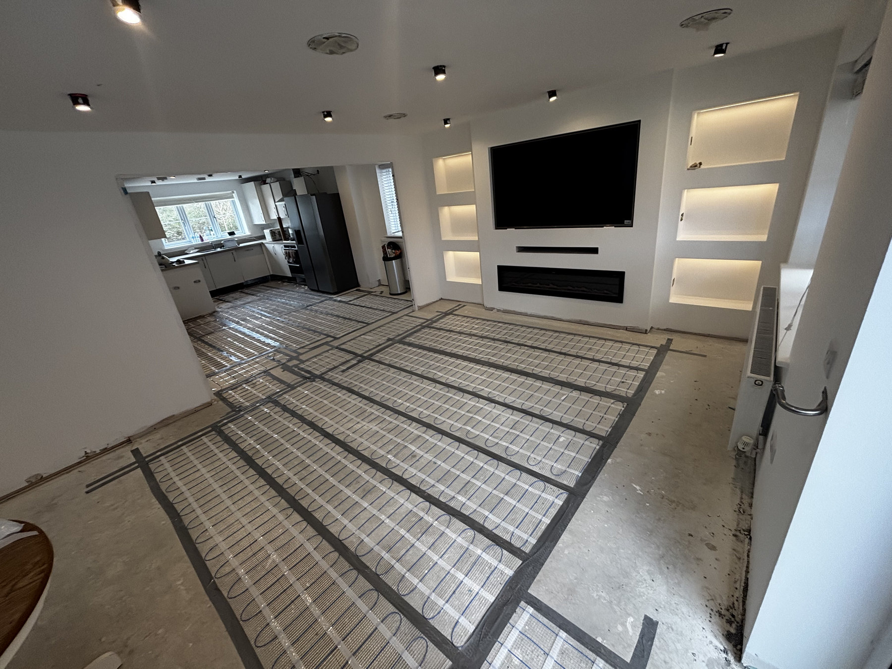 Ground-floor wiring work during a Wixams refurbishment