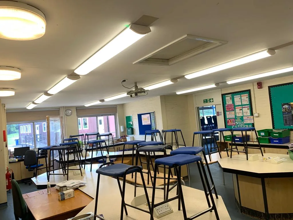Ceiling lighting above classroom tables