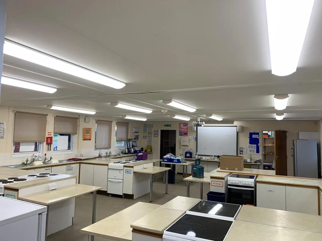 Ceiling lighting above classroom workbenches