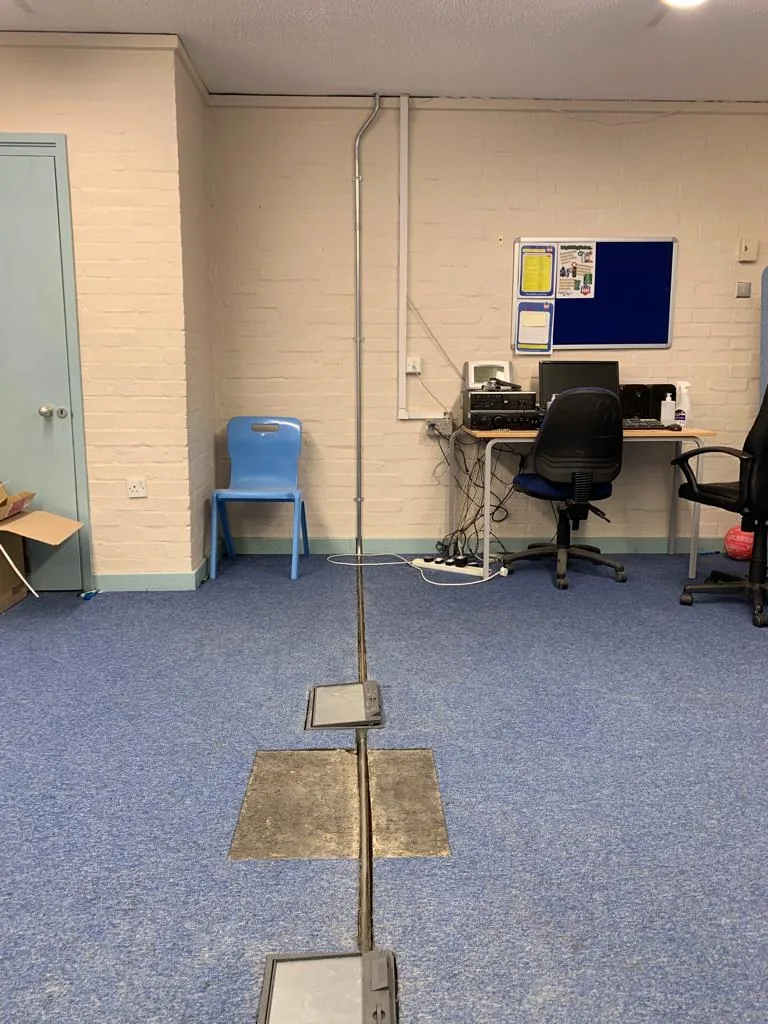 Floor cable-management route in an occupied room