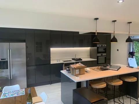 Pendant and recessed lighting above a kitchen island